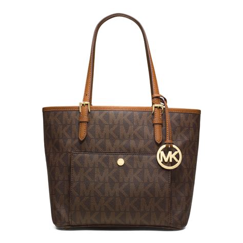 michael kors jet set logo medium travel tote brown|michael kors bag with airplanes.